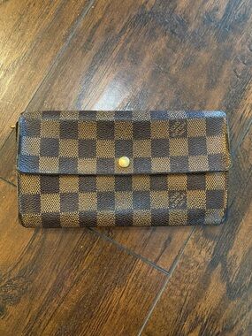 Louis Vuitton Sarah Wallet in Damier Ebene coated canvas